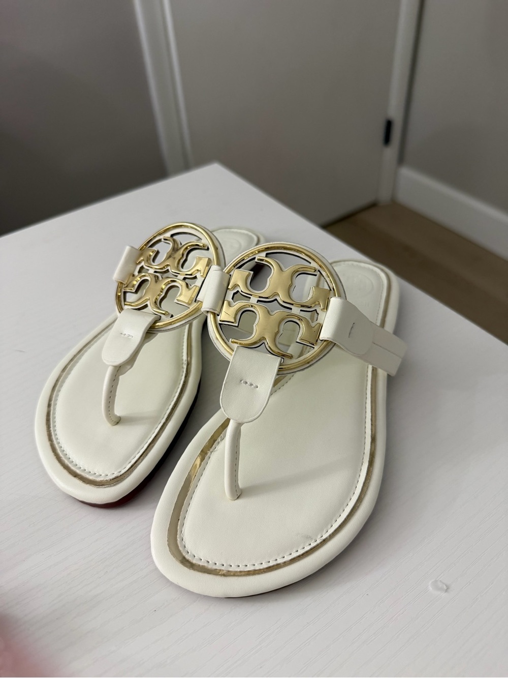 Tory Burch Cream Leather Thong Sandals with Gold Logo Emblem